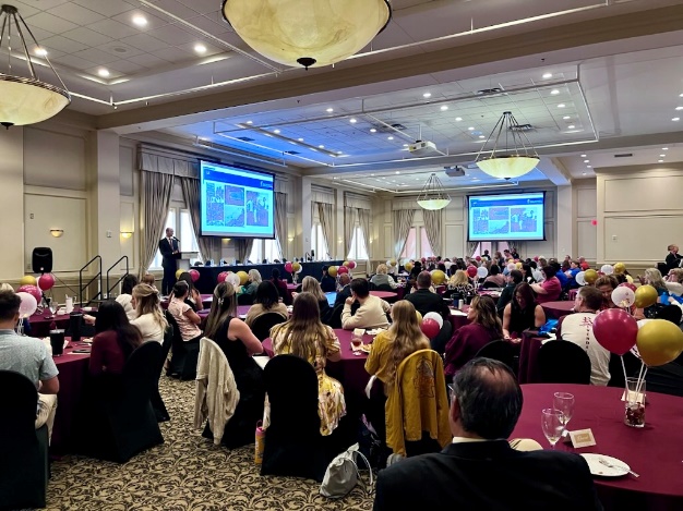 SUS Admissions Tour today, September 3, hosted at Florida State University. Attendees are gathered at large round tables in the FSU Champions Club watching a presentation.